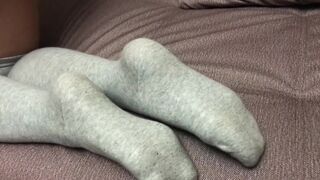 Sexy girl show feet in pantyhose and gray knee socks stockings